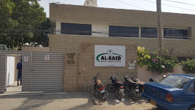 a group of motorcycles parked in front of a building